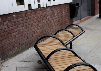 Shoreline SL005 bench. Made from Iroko timber and 316 stainless steel. From our Shoreline street furniture range