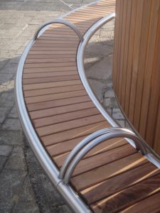 Shoreline SL008 bench and CL052 litterbin. Made from Iroko timber and 316 stainless steel. From our Shoreline street furniture range