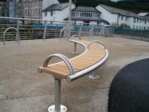 Shoreline SL008 bench and CL052 litterbin. Made from Iroko timber and 316 stainless steel. From our Shoreline street furniture range