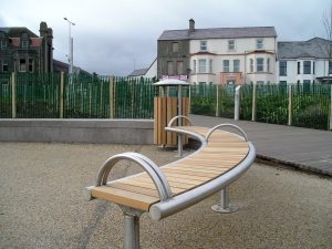 Shoreline SL008 bench and SL052 litterbin. Made from Iroko and stainless steel