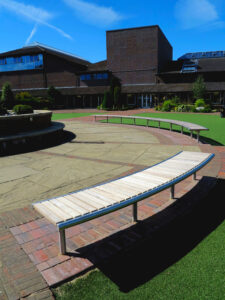 Bespoke stainless steel and hardwood curved bench