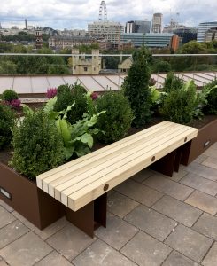 Bespoke dimension Accoya and aluminium bench. Finished in a "corten" like power coat