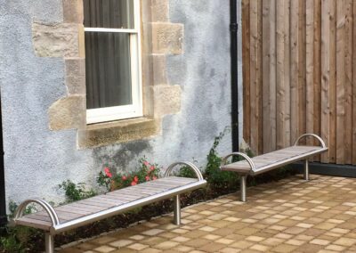stainless steel and wood bench with armrests