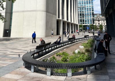 large curved recycled plastic and steel bench