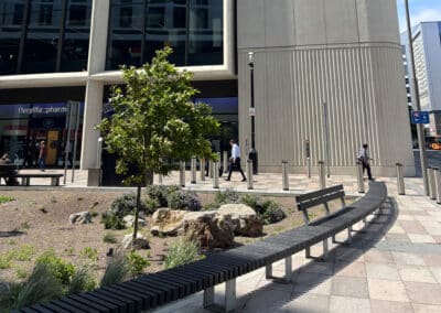 large curved recycled plastic and steel bench